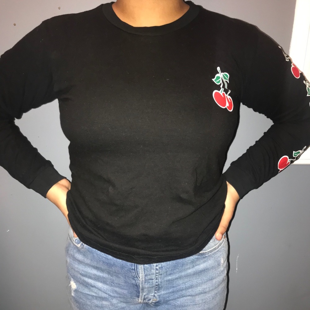 Black long sleeve shirt with writing.